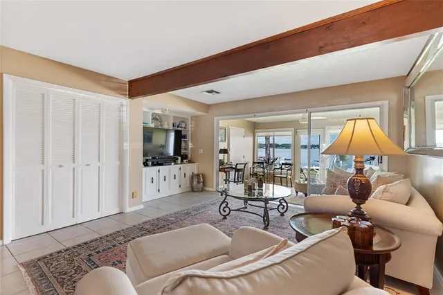 a living room with furniture a table and chairs