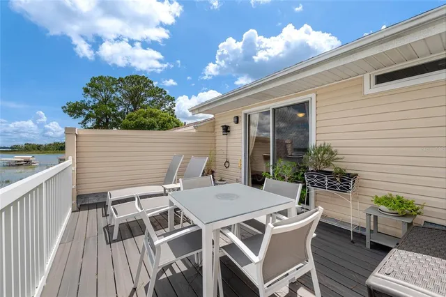 a view of a patio with a table and chairs
