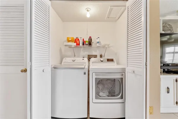 a utility room with dryer and washer
