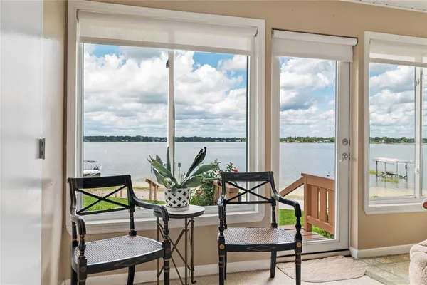 a dining room with furniture window and outside view