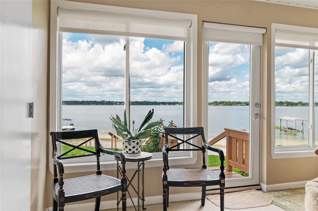 11001 Southeast Sunset Harbor Road, Unit B13 Summerfield, FL 34491 - Photo 39 of 50 a dining room with furniture window and outside view