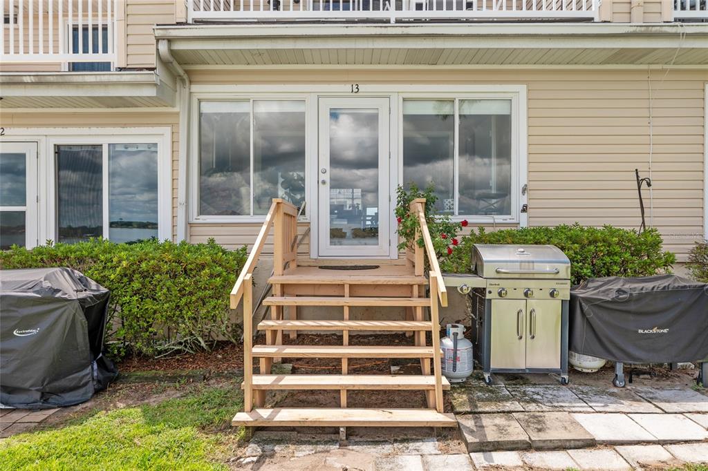 11001 Southeast Sunset Harbor Road, Unit B13 Summerfield, FL 34491 - Photo 41 of 50 a view of a house with backyard and sitting area