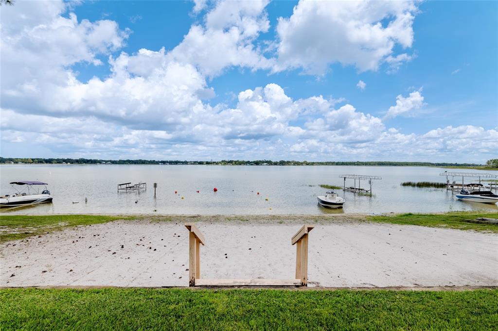 11001 Southeast Sunset Harbor Road, Unit B13 Summerfield, FL 34491 - Photo 48 of 50 a view of a dry yard with lots of green space