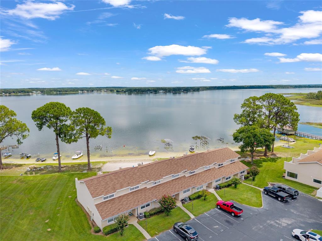 11001 Southeast Sunset Harbor Road, Unit B13 Summerfield, FL 34491 - Photo 49 of 50 a view of a lake with a terrace