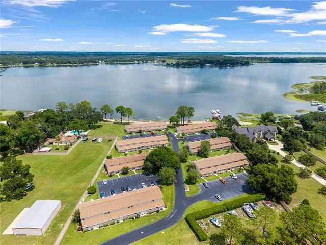 an aerial view of a house with lake view