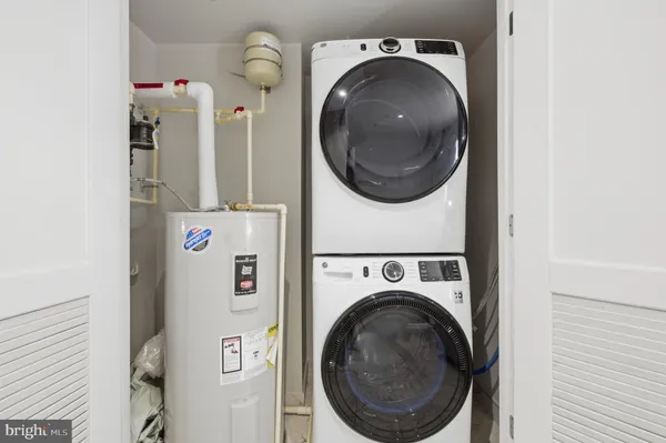 a close view of a utility room with dryer and washer