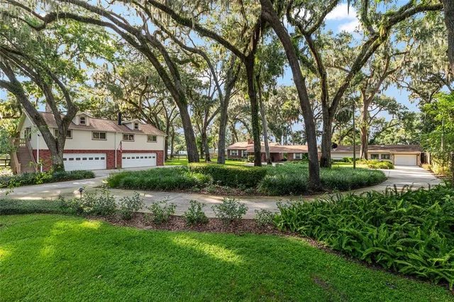 front view of a brick house with a large window