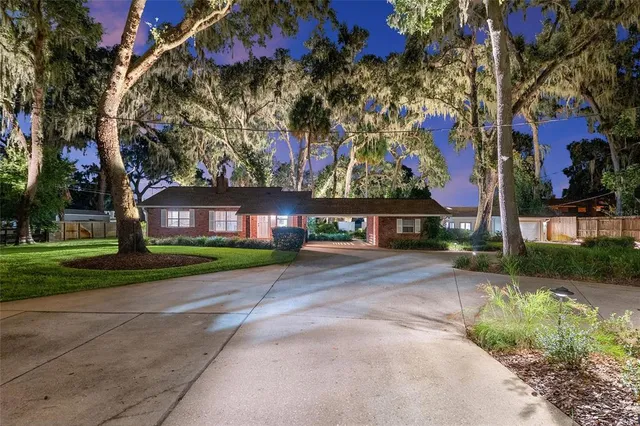 a kitchen with stainless steel appliances granite countertop sink stove top oven and cabinets