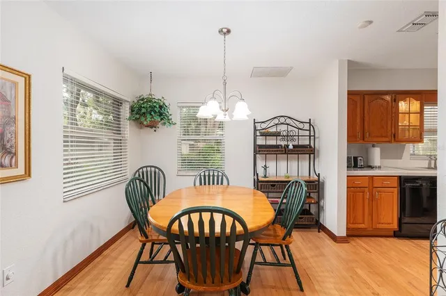 a view of house with a yard