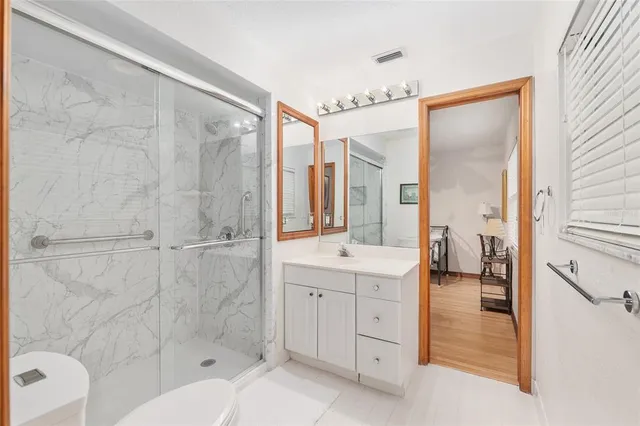a view of kitchen with furniture and wooden floor