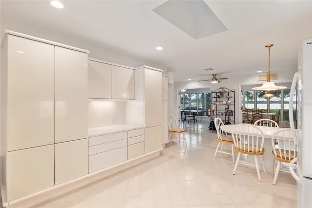 a bathroom with a glass shower door and a glass door