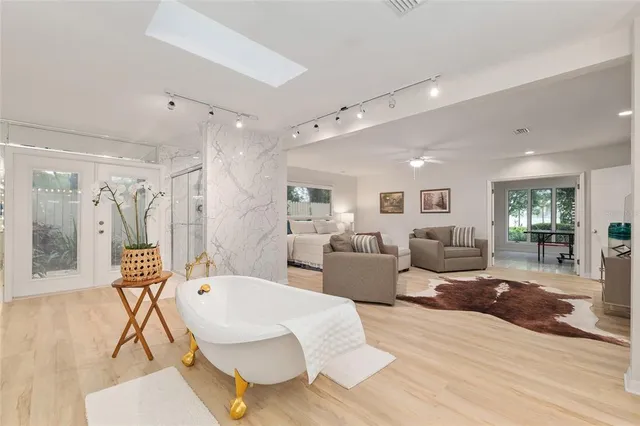 a bedroom with a bed and a fireplace