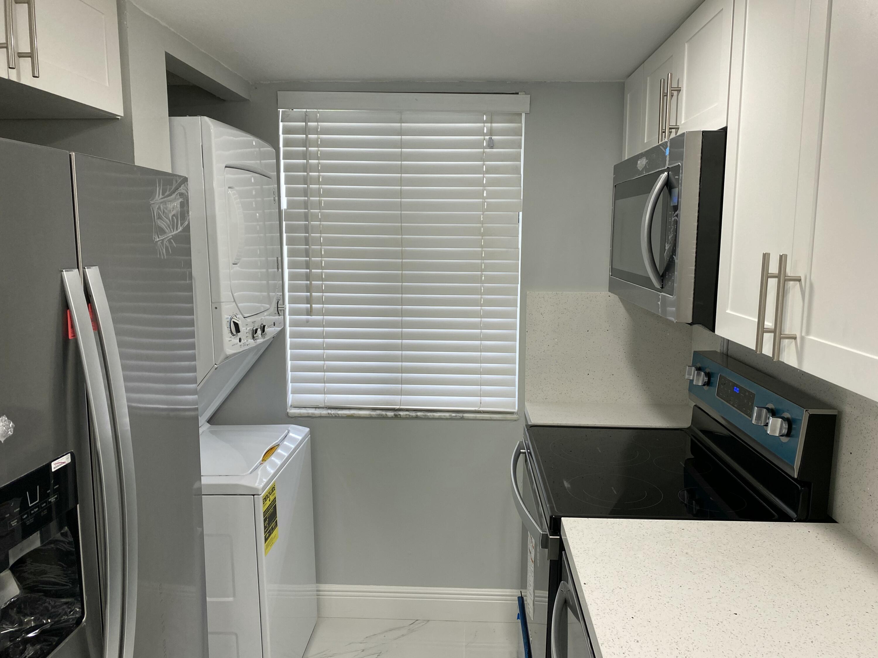 2788 Tennis Club Drive, Unit 102 West Palm Beach, FL 33417 - Photo 16 of 26 a view of walk in closet