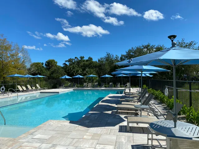 a view of a swimming pool with a patio