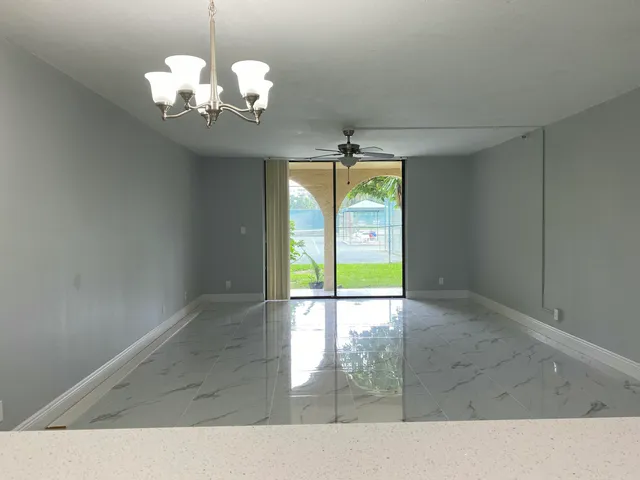 a kitchen with kitchen island a sink stainless steel appliances and cabinets