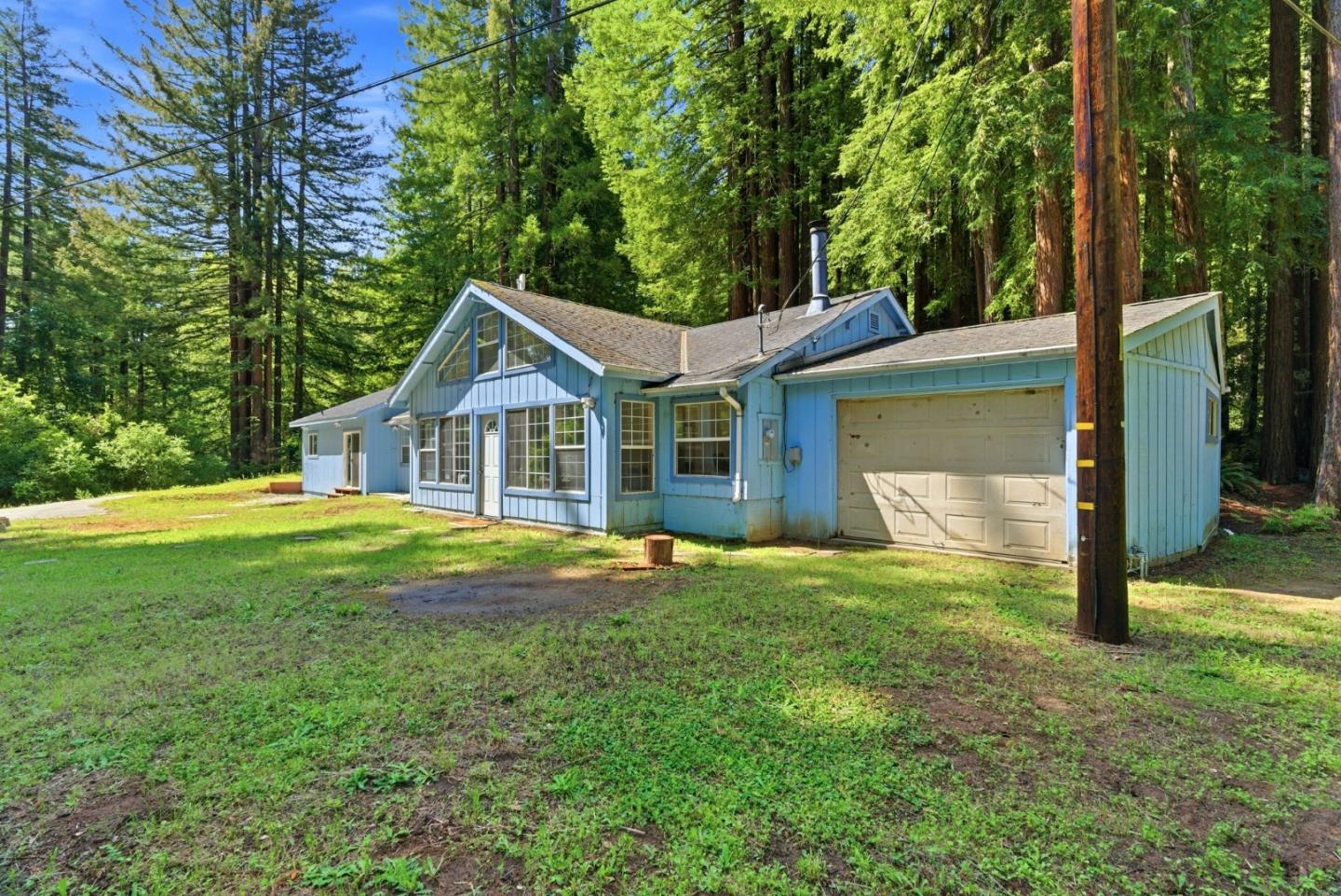 1460 Tucker Road Scotts Valley, CA 95066 - Photo 4 of 32 a house that has a big yard with large trees