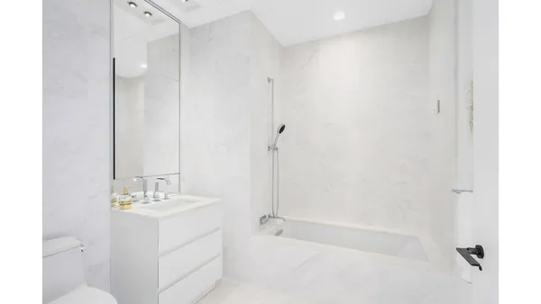 a room with furniture and a large window