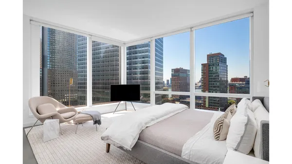 a bathroom with a shower sink vanity and mirror