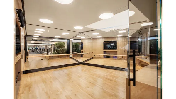 a room with gym equipment and a large window