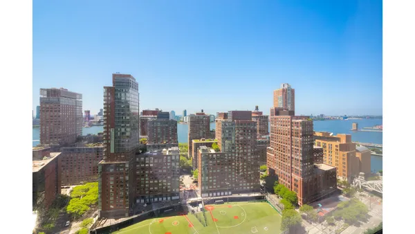a kitchen with stainless steel appliances kitchen island granite countertop a refrigerator and a sink