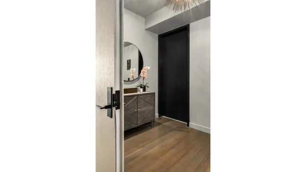 a view of a lake with tall buildings