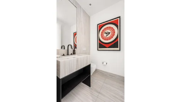 a view of a hallway with bathroom