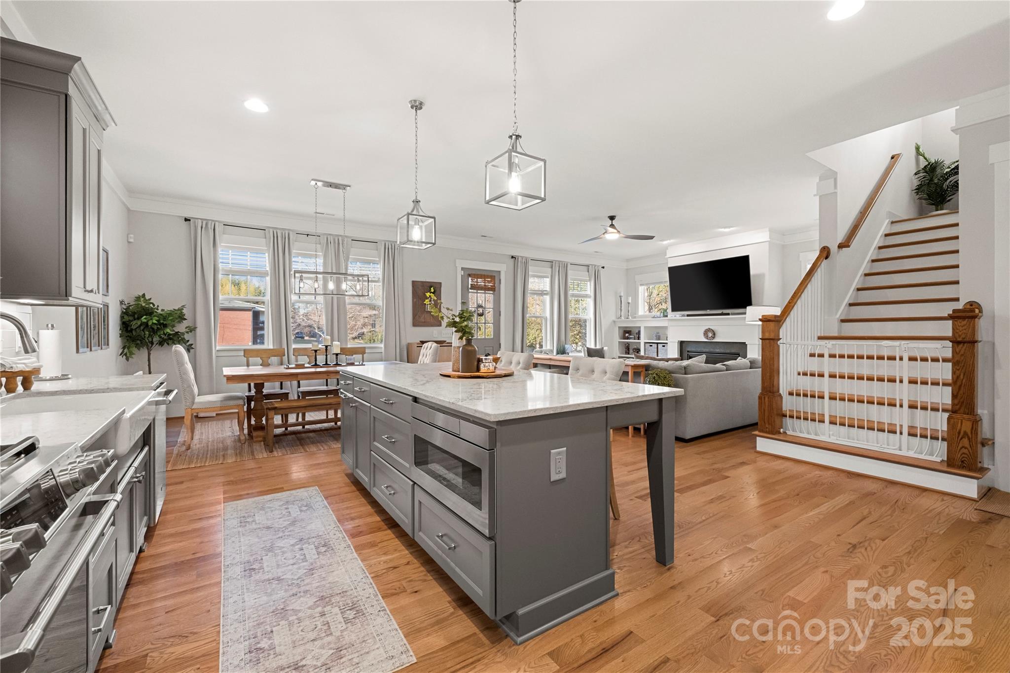 907 Millbrook Road Charlotte, NC 28211 - Photo 12 of 46 a kitchen with stainless steel appliances granite countertop a stove and a view of living room