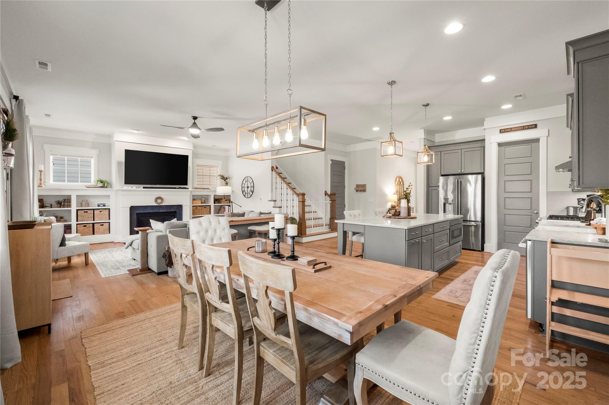 907 Millbrook Road Charlotte, NC 28211 - Photo 17 of 46 a dining room with stainless steel appliances kitchen island granite countertop a table chairs and a stove