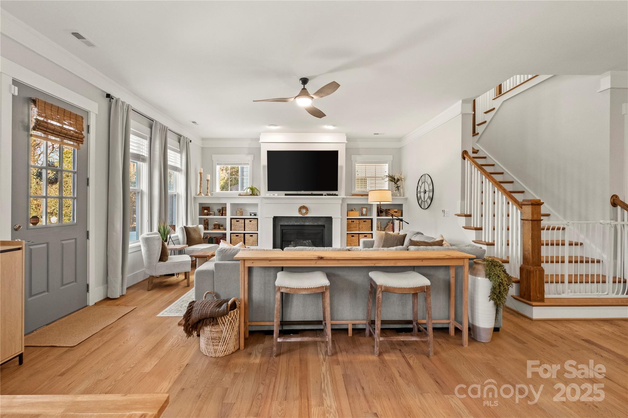 907 Millbrook Road Charlotte, NC 28211 - Photo 18 of 46 a living room with furniture a fireplace and a flat screen tv
