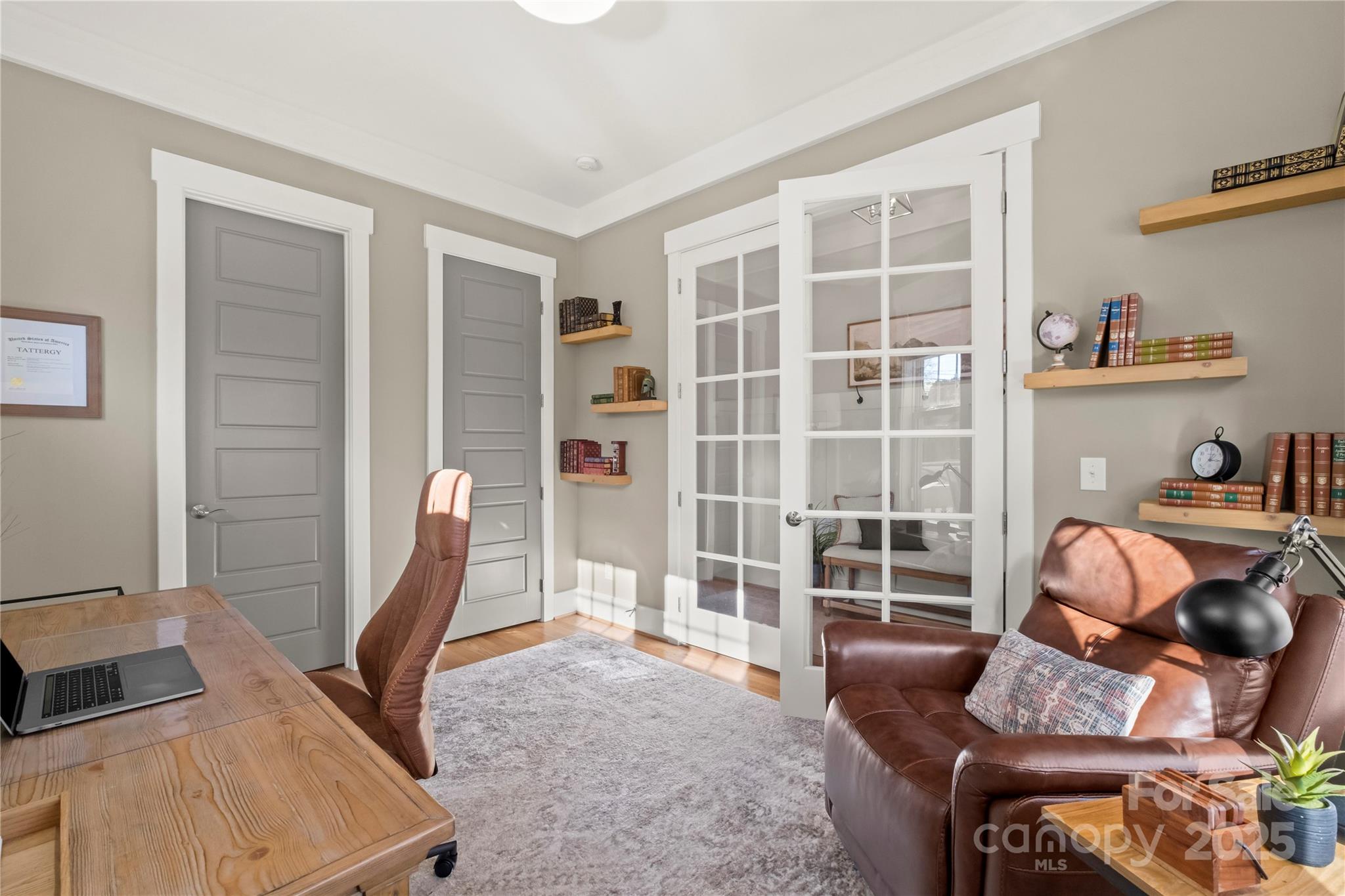 907 Millbrook Road Charlotte, NC 28211 - Photo 4 of 46 a living room with furniture and a floor to ceiling window