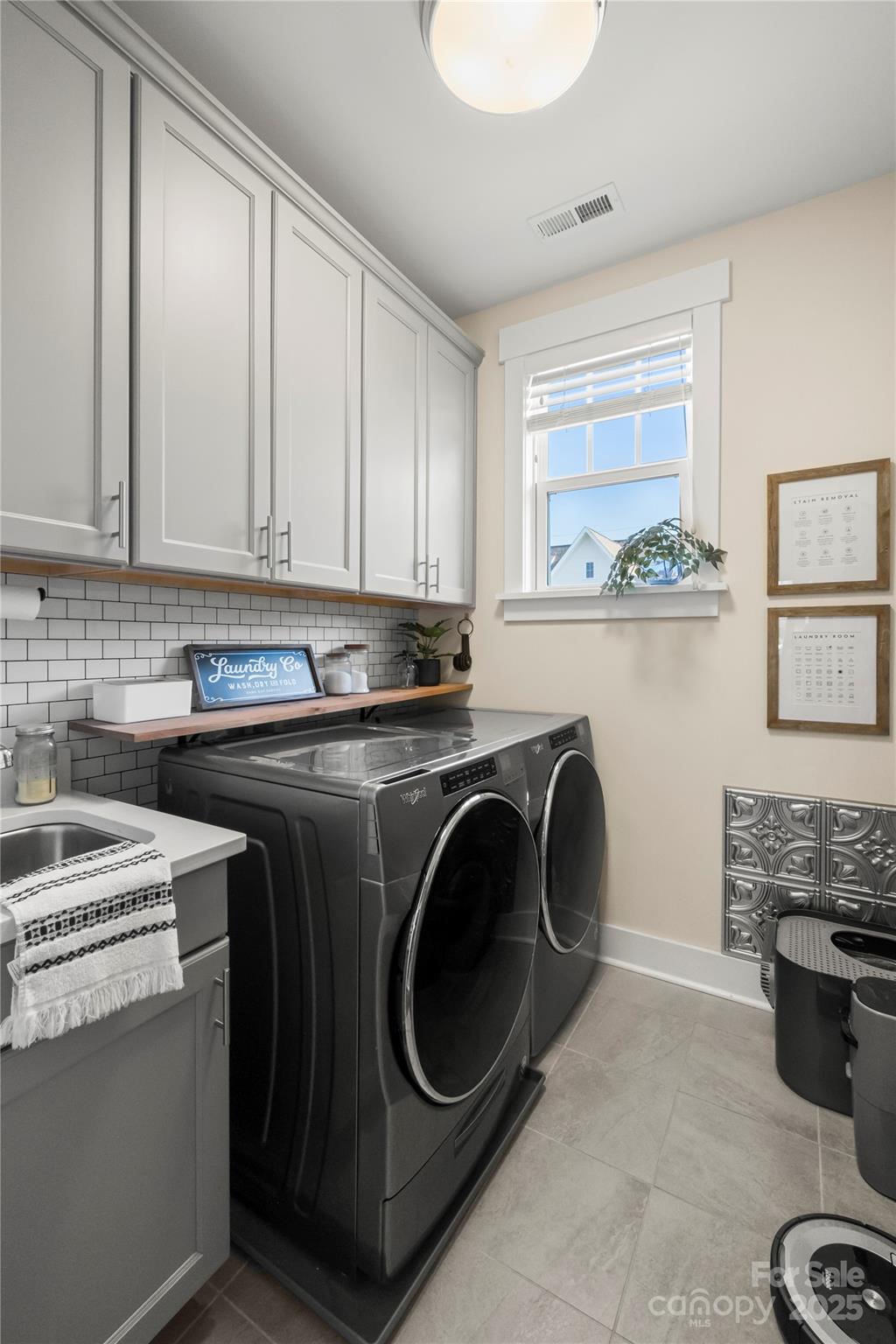 907 Millbrook Road Charlotte, NC 28211 - Photo 41 of 46 a utility room with sink dryer and washer