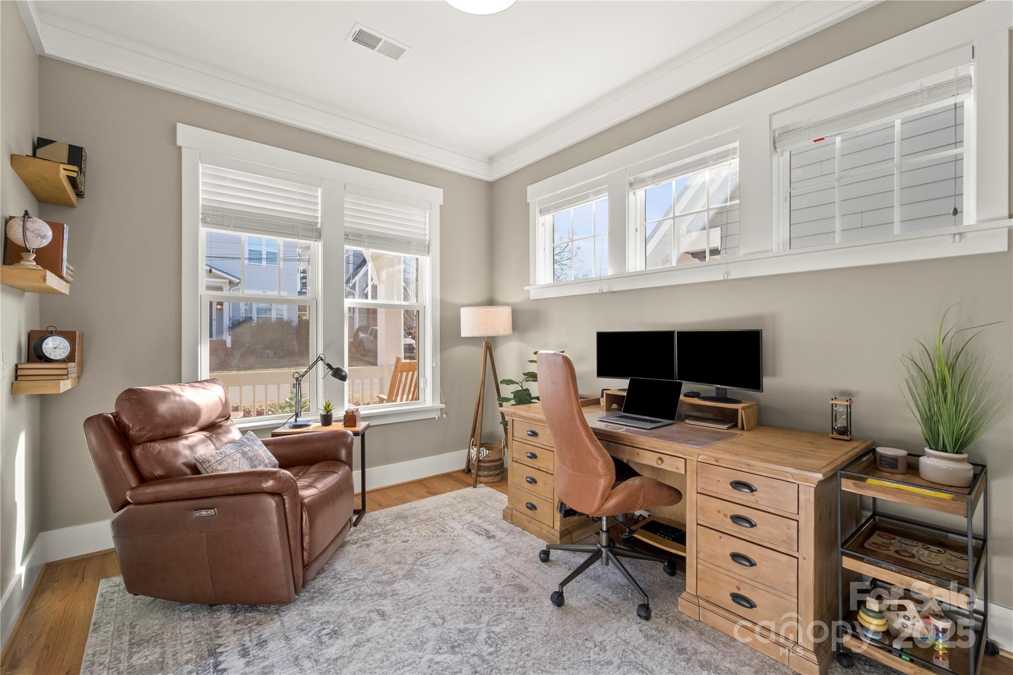 907 Millbrook Road Charlotte, NC 28211 - Photo 6 of 46 a view of a livingroom with workspace and a window