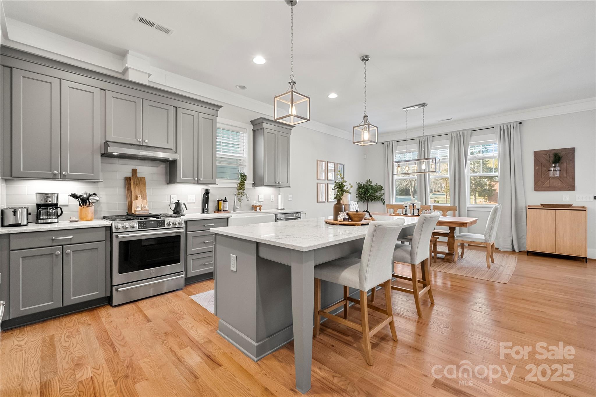 907 Millbrook Road Charlotte, NC 28211 - Photo 9 of 46 a kitchen with a sink window and cabinets