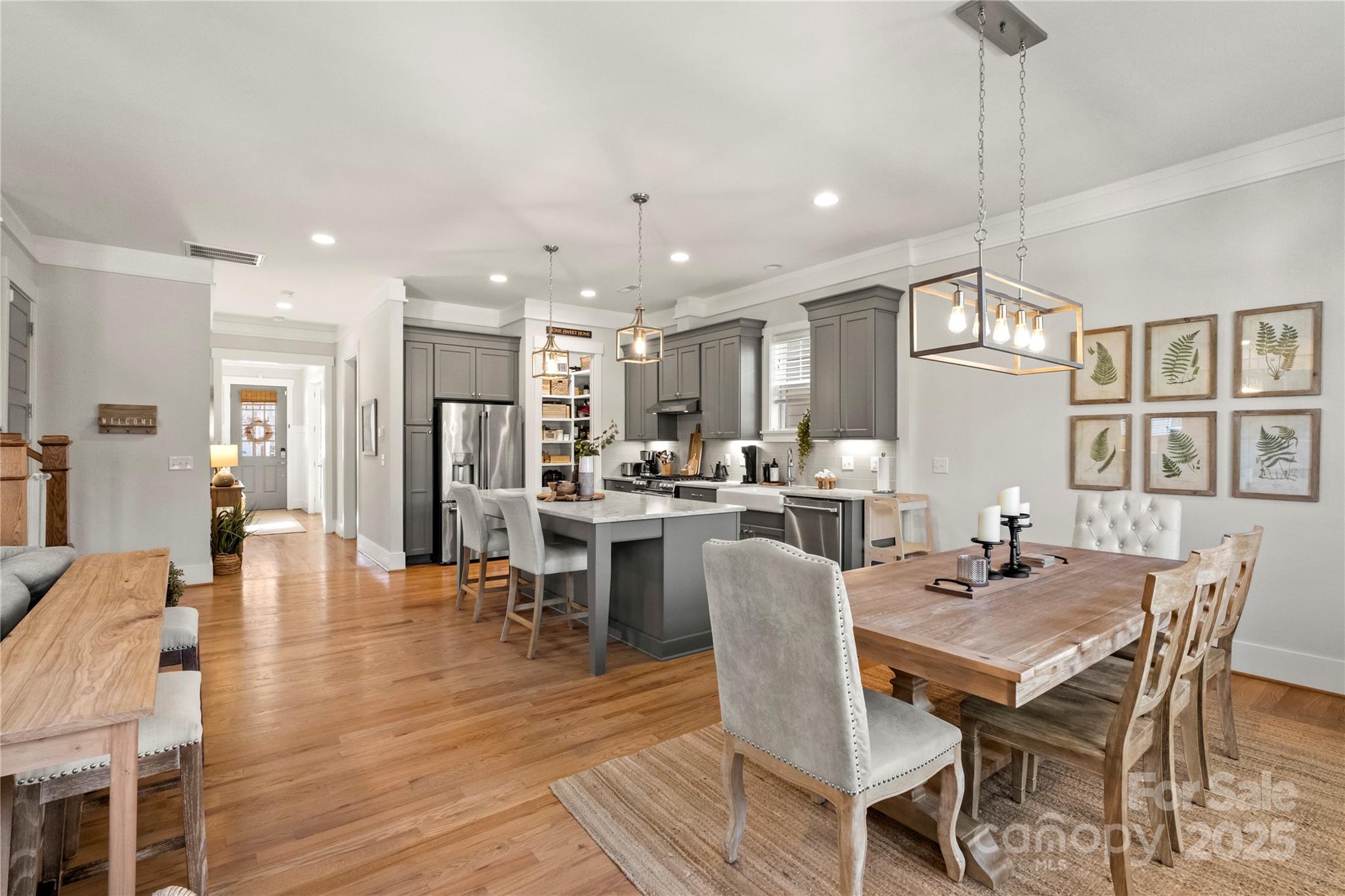 907 Millbrook Road Charlotte, NC 28211 - Photo 10 of 46 a dining room with stainless steel appliances kitchen island granite countertop a dining table chairs and a oven