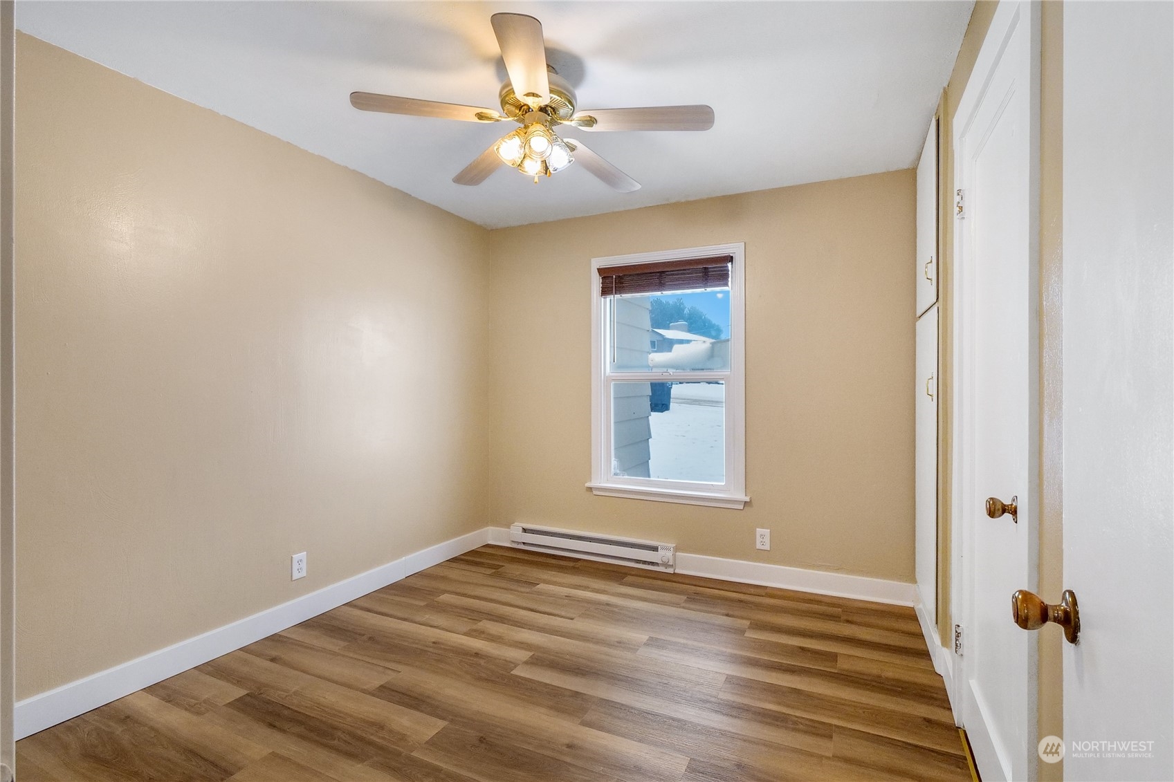 233 Statter Road Ephrata, WA 98823 - Photo 20 of 31 an empty room with a chandelier fan and windows