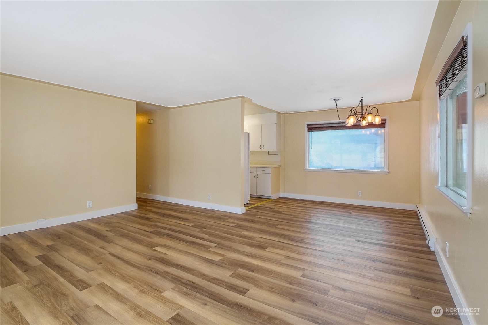 233 Statter Road Ephrata, WA 98823 - Photo 5 of 31 a view of an empty room with window and wooden floor