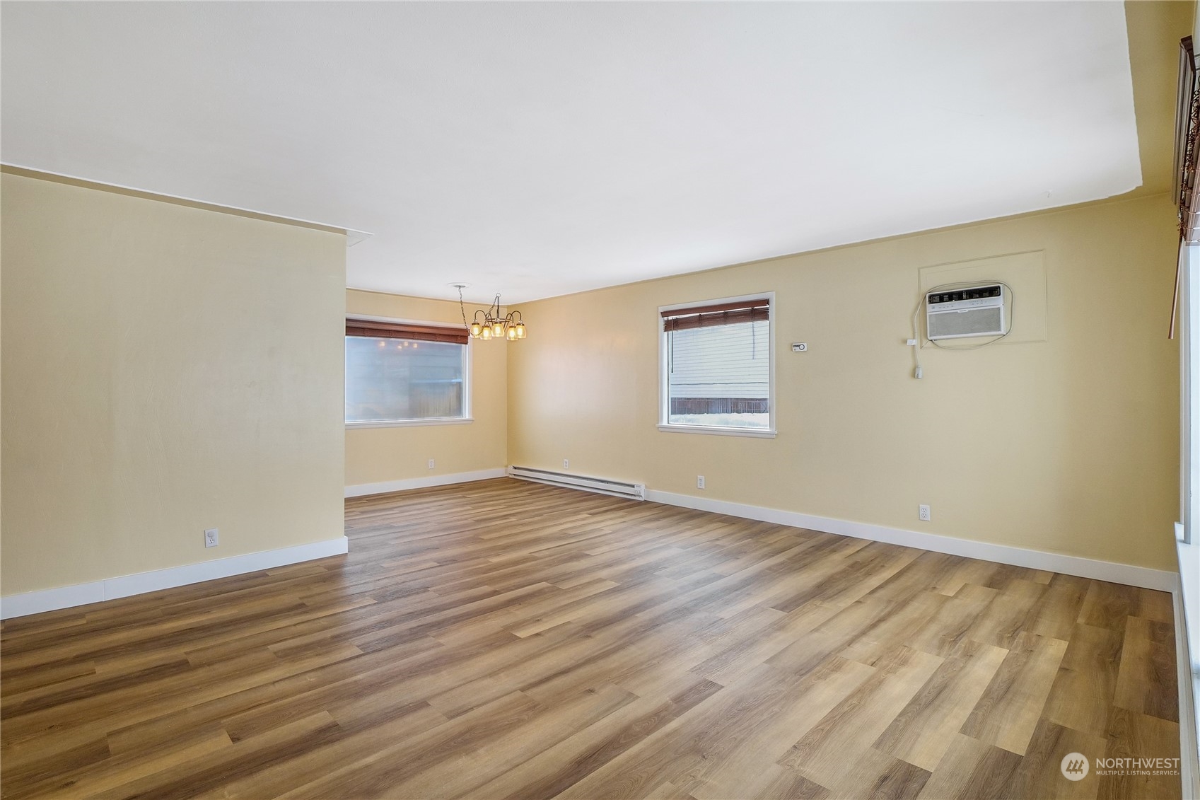 233 Statter Road Ephrata, WA 98823 - Photo 6 of 31 a view of an empty room with wooden floor and a window
