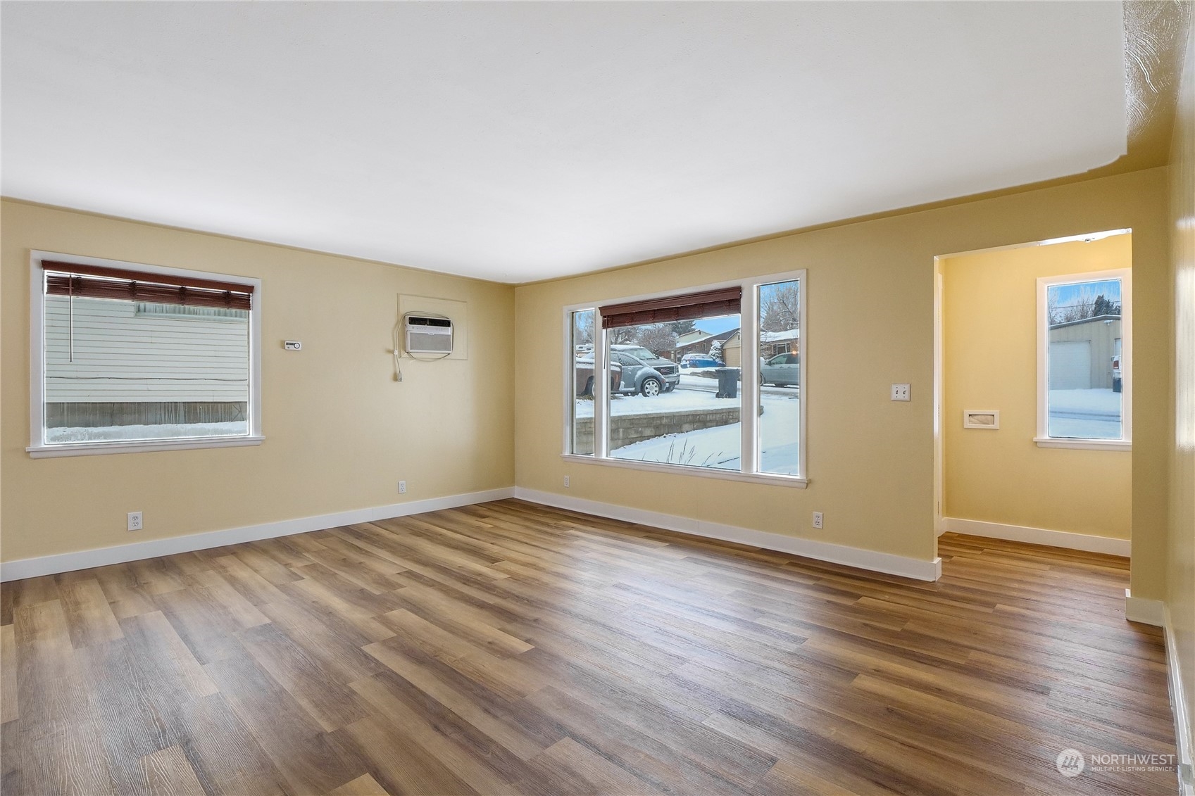 233 Statter Road Ephrata, WA 98823 - Photo 7 of 31 a view of an empty room with window and wooden floor