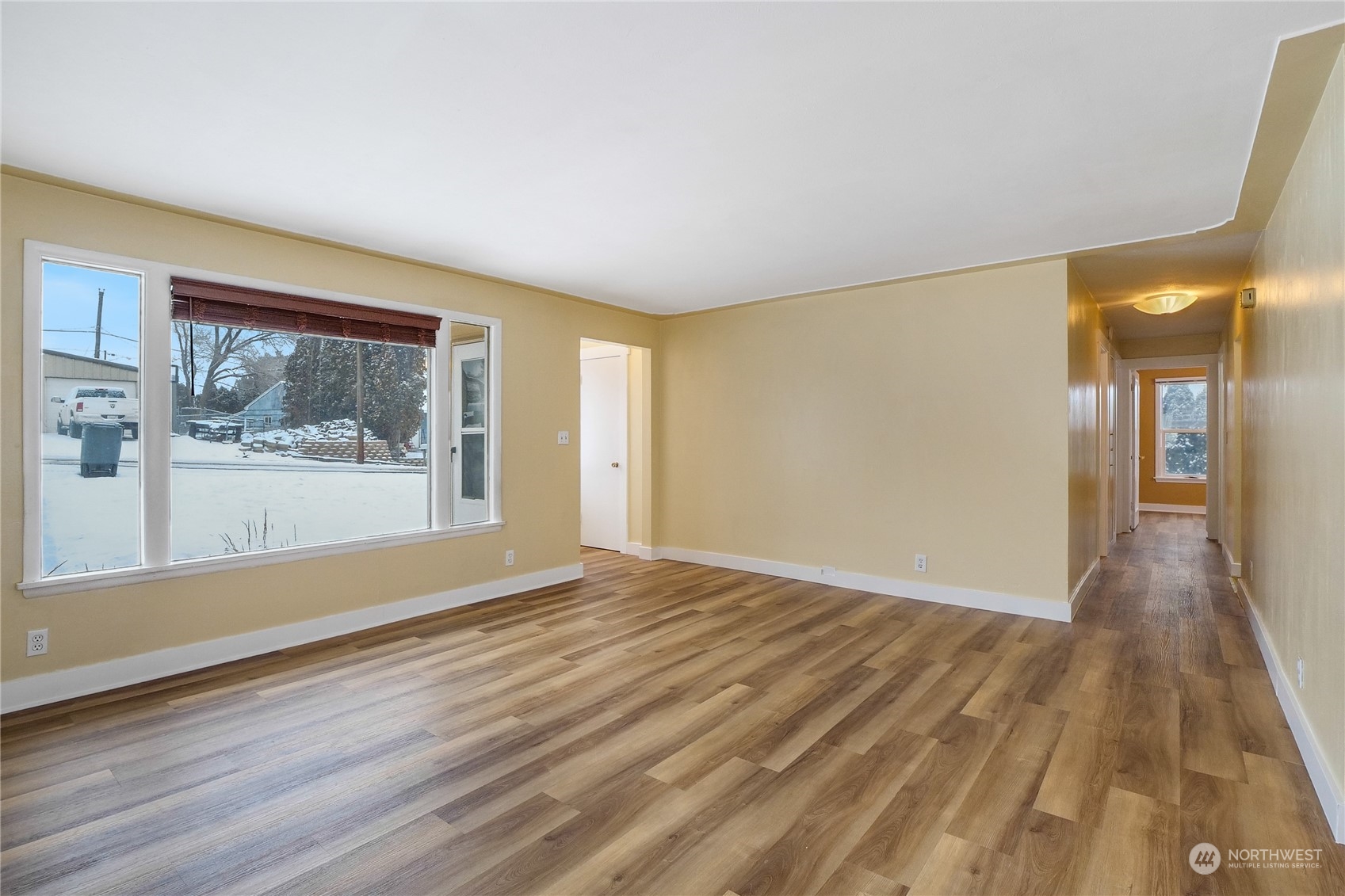 233 Statter Road Ephrata, WA 98823 - Photo 9 of 31 a view of a big room with wooden floor and windows