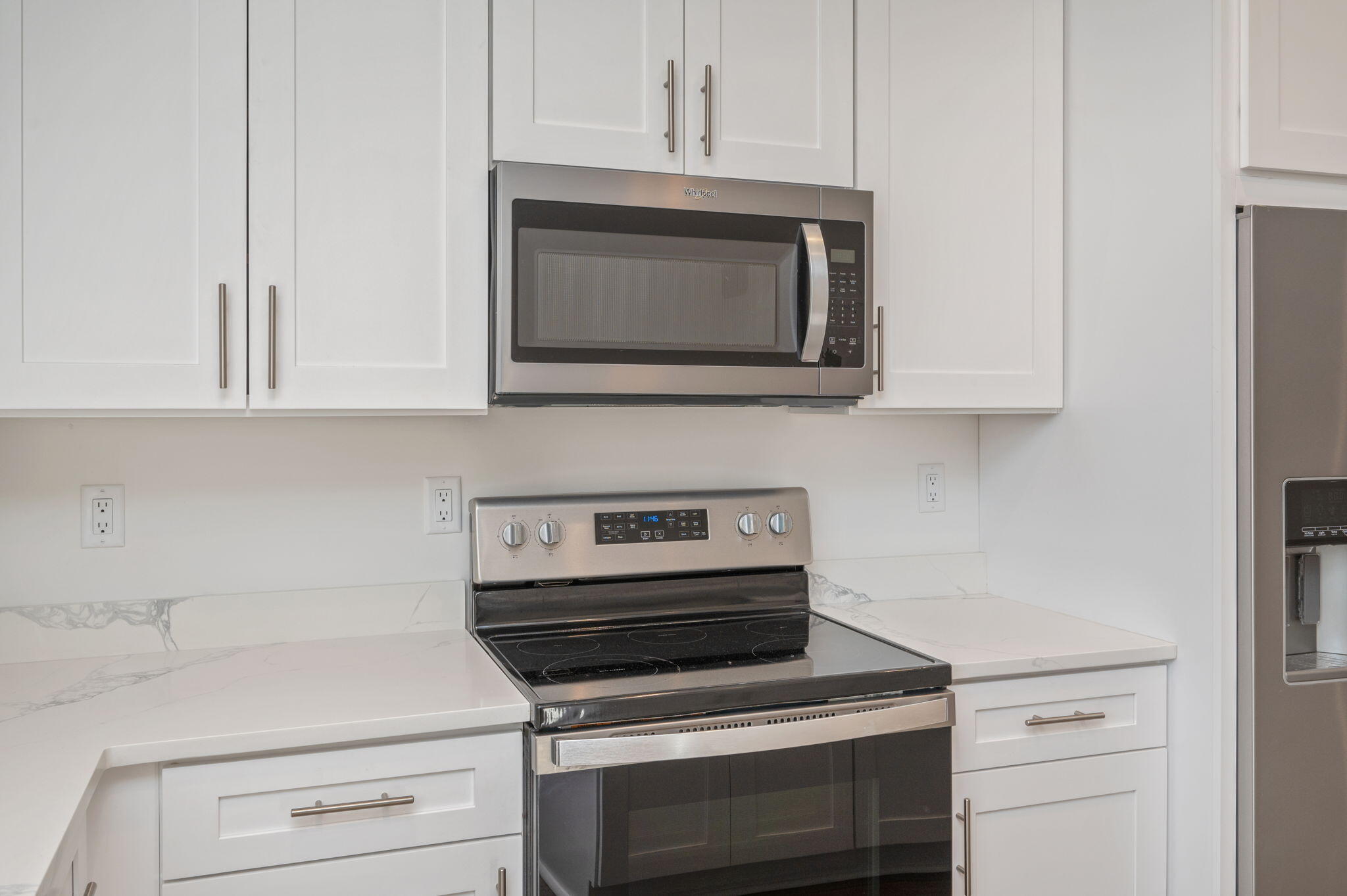 68 Iris Lane DeFuniak Springs, FL 32433 - Photo 11 of 34 a kitchen with microwave cabinets and stove top oven