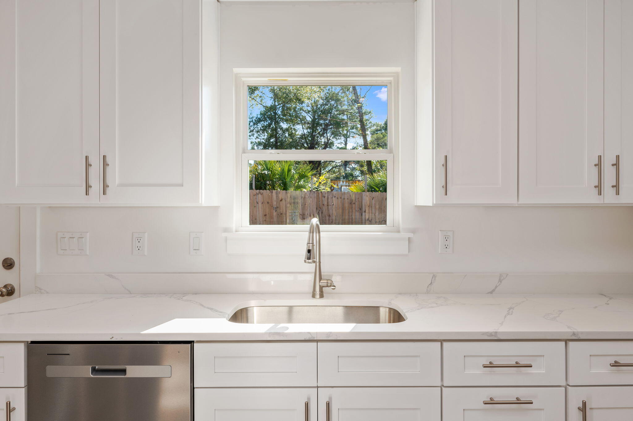 68 Iris Lane DeFuniak Springs, FL 32433 - Photo 12 of 34 a kitchen with appliances cabinets and a window
