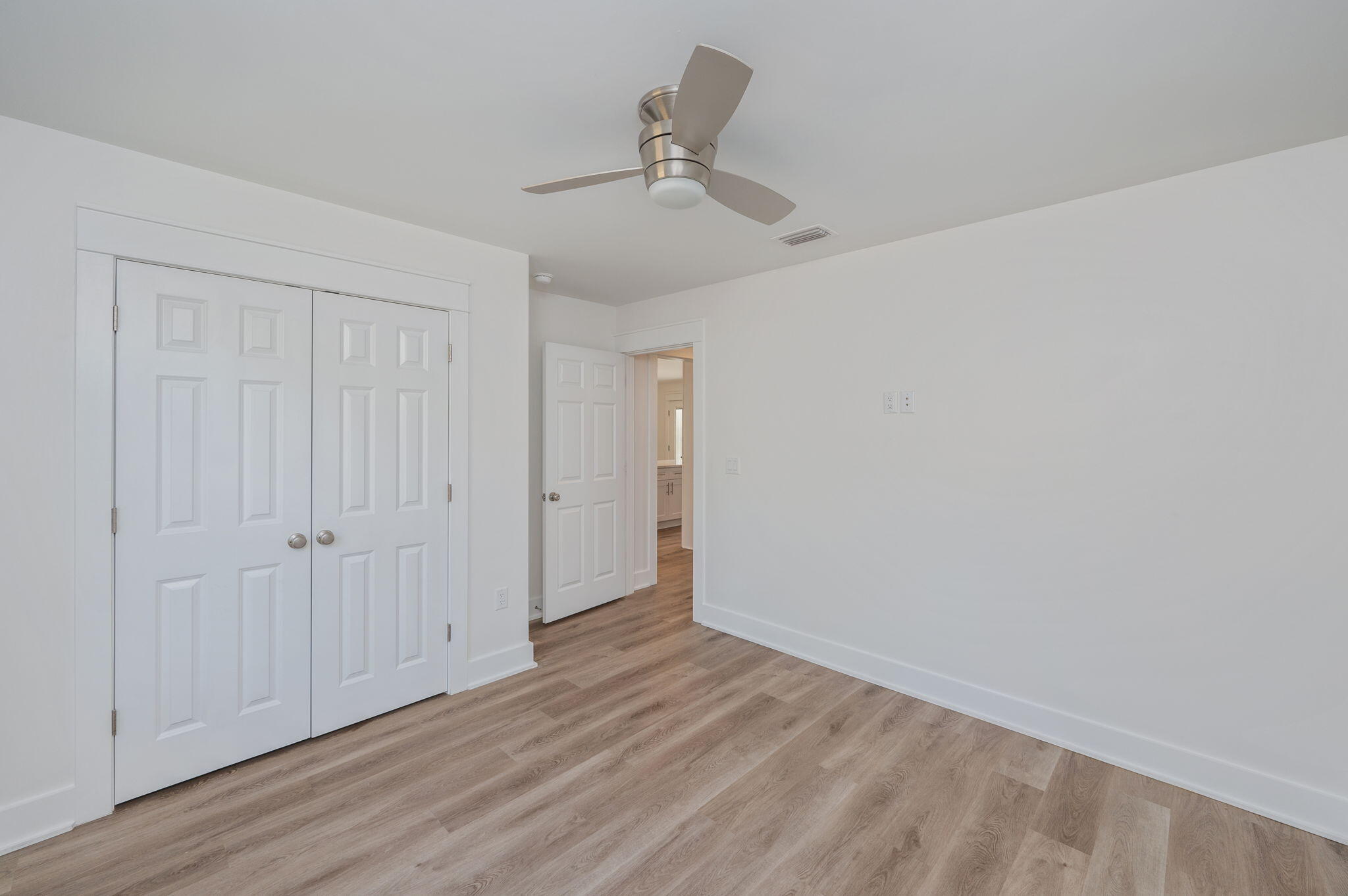 68 Iris Lane DeFuniak Springs, FL 32433 - Photo 16 of 34 wooden floor in an empty room