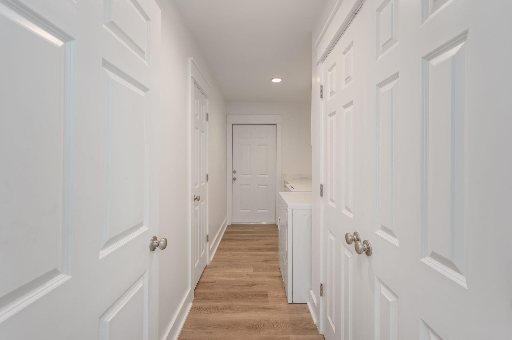 68 Iris Lane DeFuniak Springs, FL 32433 - Photo 20 of 34 a view of a hallway with wooden floor and staircase