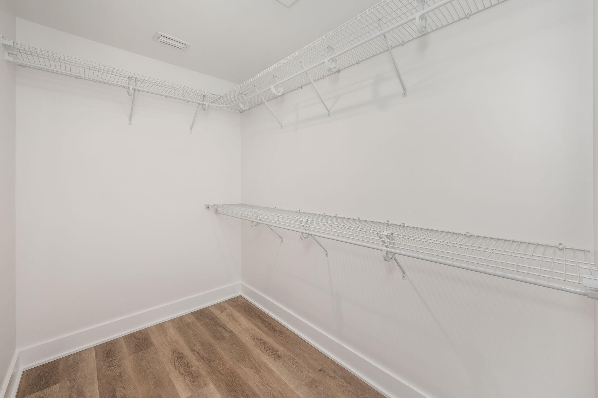 68 Iris Lane DeFuniak Springs, FL 32433 - Photo 23 of 34 a view of a room with racks on the wall