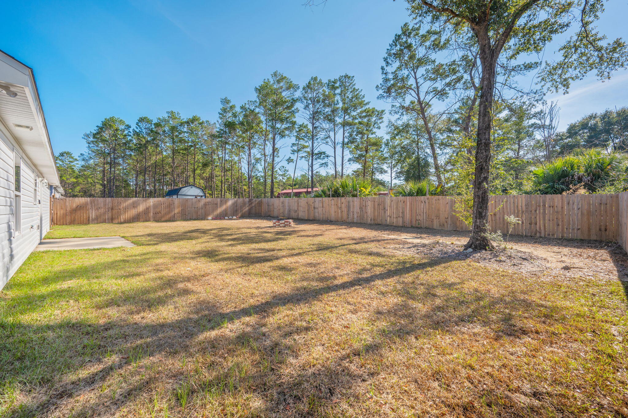 68 Iris Lane DeFuniak Springs, FL 32433 - Photo 34 of 34 a view of backyard with trees