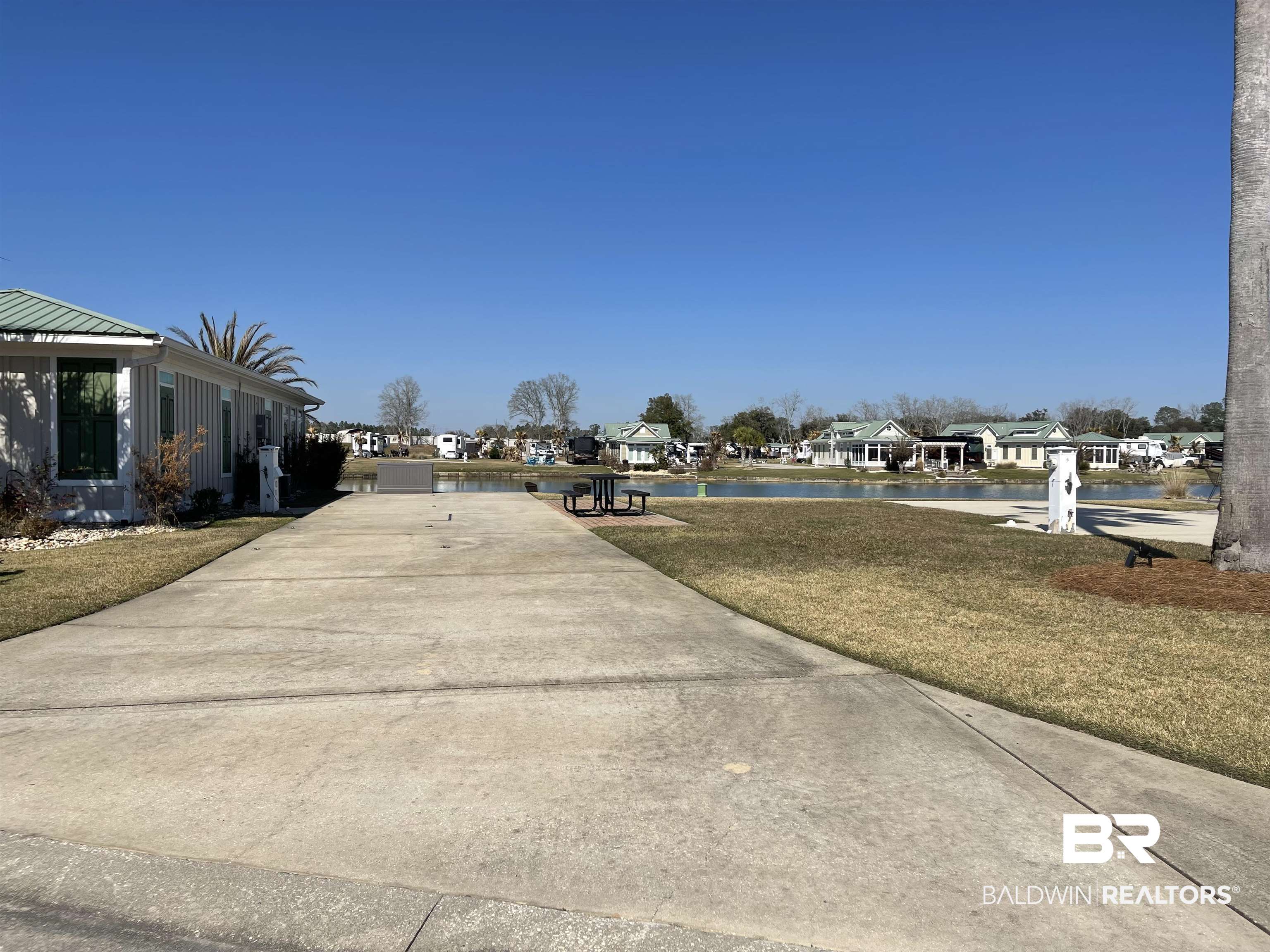27441 Highway 98 Elberta, AL 36530 - Photo 8 of 20 View of street with a residential view, concrete driveway, and a water view