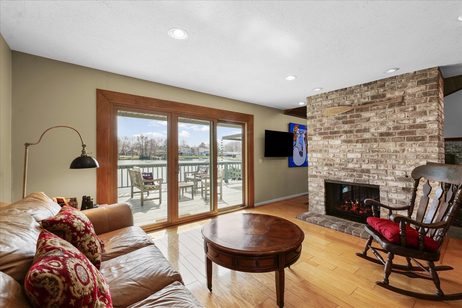 1850 Maynard Drive Champaign, IL 61822 - Photo 12 of 61 a living room with furniture a fireplace and a floor to ceiling window