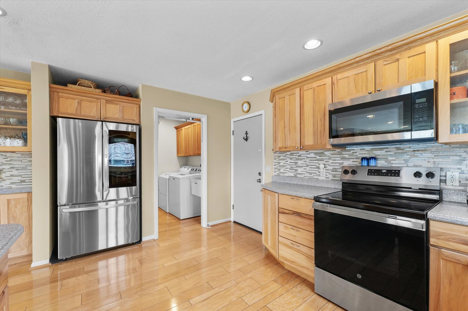 1850 Maynard Drive Champaign, IL 61822 - Photo 15 of 61 a kitchen with stainless steel appliances a stove microwave and refrigerator