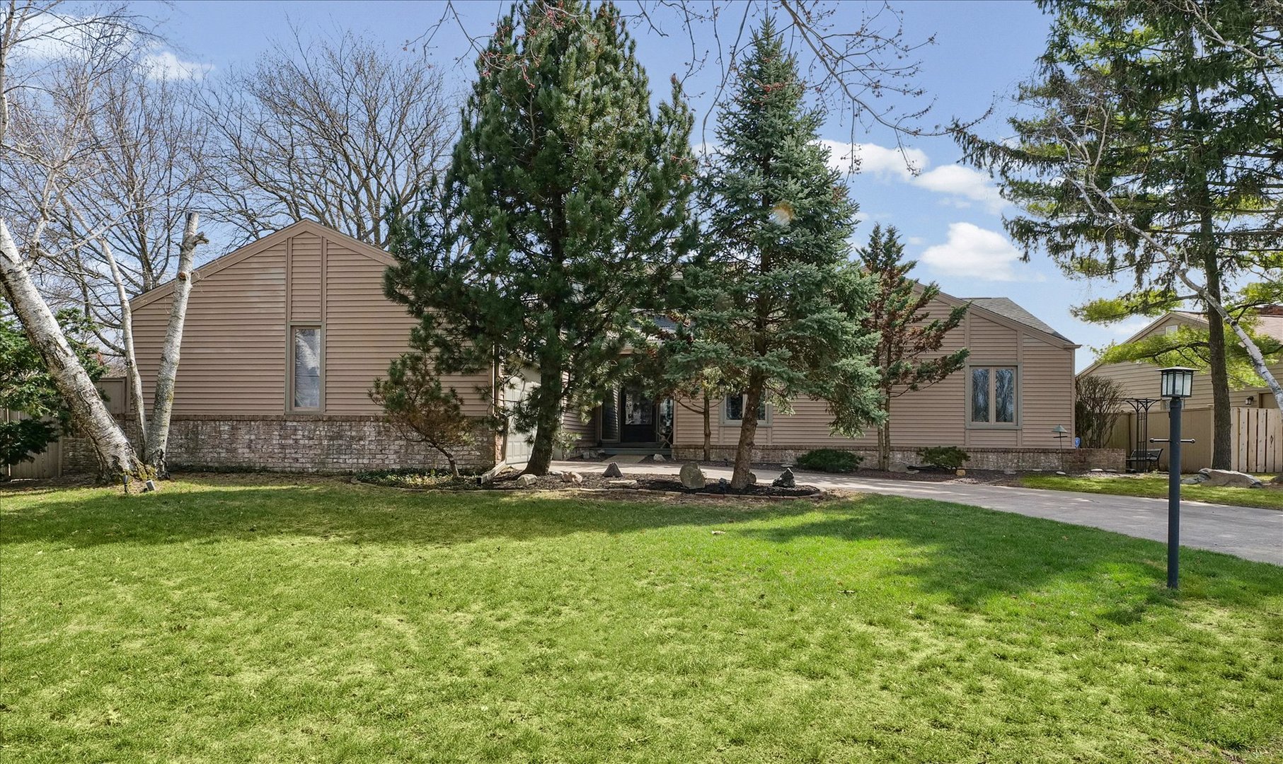 1850 Maynard Drive Champaign, IL 61822 - Photo 2 of 61 a backyard of a house with lots of green space and fountain