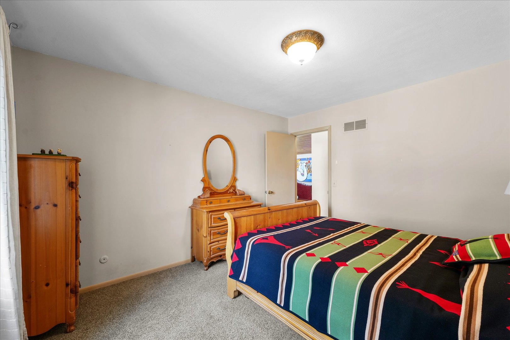 1850 Maynard Drive Champaign, IL 61822 - Photo 25 of 61 a bedroom with a bed and a chandelier